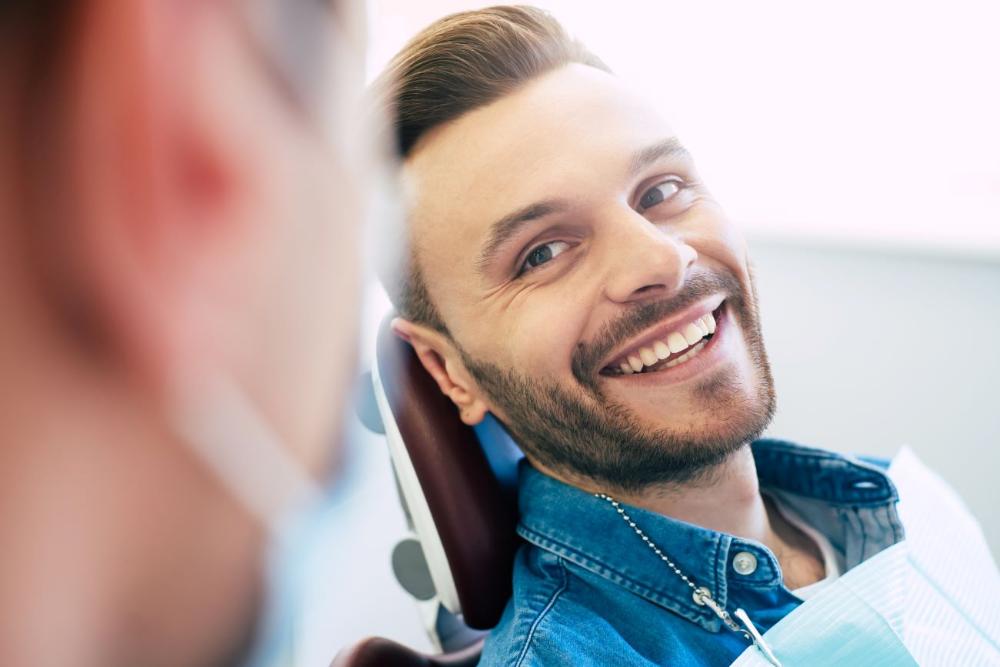 white hills man smiling in dental chair