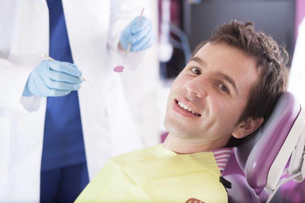 white hills man smiling in dental chair | emergency dentist bendigo