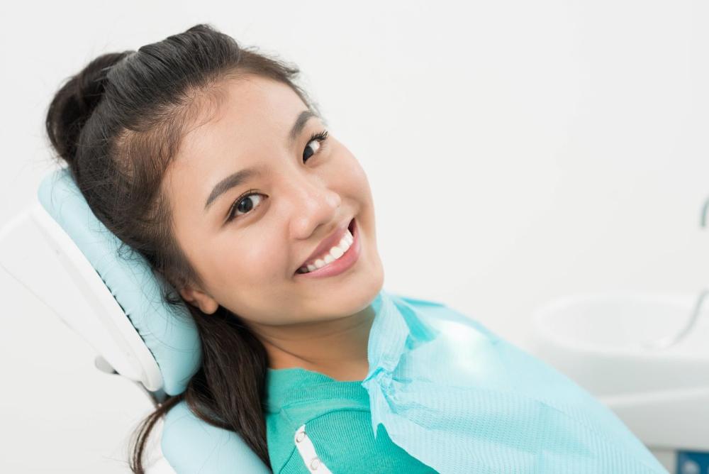 woman smiling in dental chair | dentist white hills vic